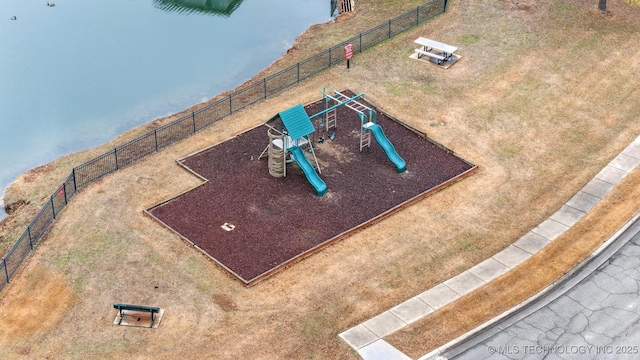 birds eye view of property featuring a water view