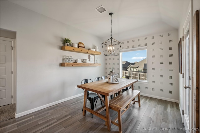 dining space with a chandelier