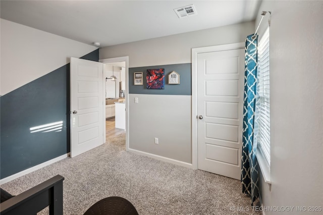 unfurnished bedroom with carpet flooring