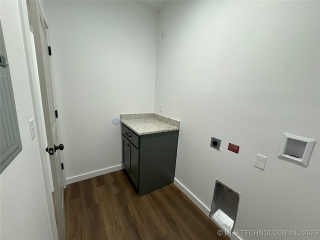 washroom with hookup for an electric dryer and dark wood-type flooring