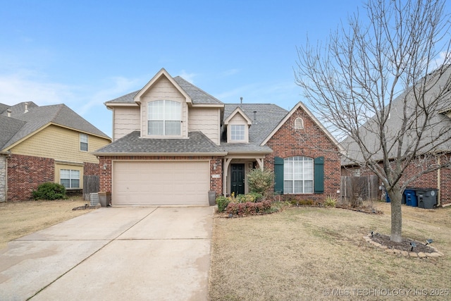 front of property featuring a garage and a front lawn