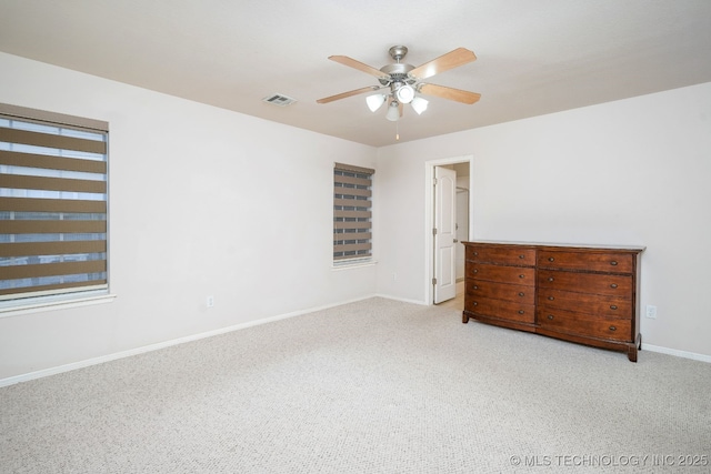 unfurnished bedroom with light carpet and ceiling fan