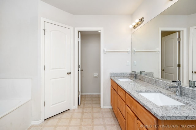 bathroom featuring vanity and a washtub