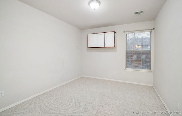 view of carpeted spare room