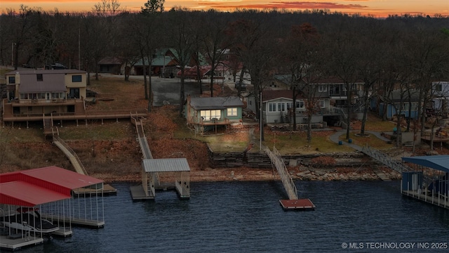 aerial view at dusk with a water view