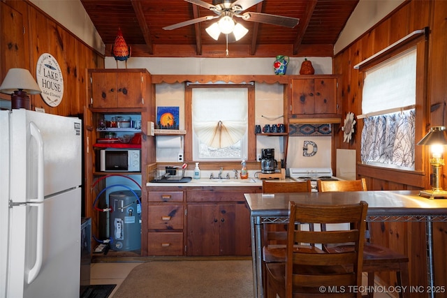 kitchen with wood ceiling, white appliances, a breakfast bar, and kitchen peninsula