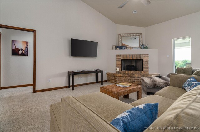 8775 Leonard St, Kingston, OK 73439 - carpeted living room featuring a brick fireplace, vaulted ceiling, and ceiling fan