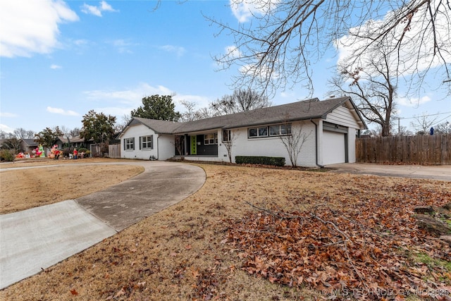 single story home with a garage