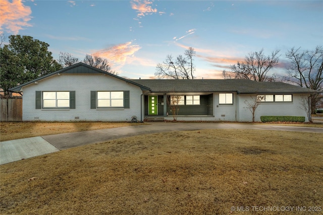 ranch-style house with a yard