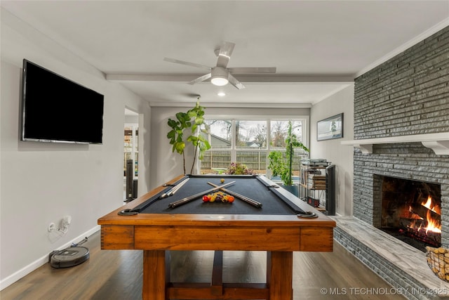 rec room featuring pool table, ceiling fan, dark hardwood / wood-style flooring, and a brick fireplace