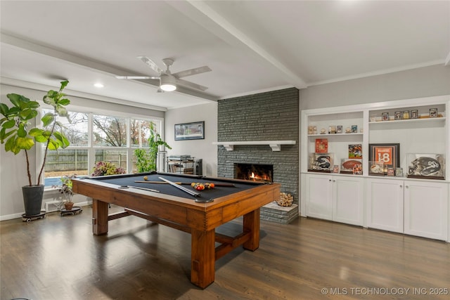 playroom featuring ceiling fan, pool table, dark hardwood / wood-style floors, and a brick fireplace