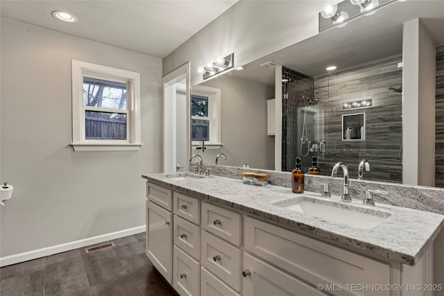 bathroom with an enclosed shower and vanity