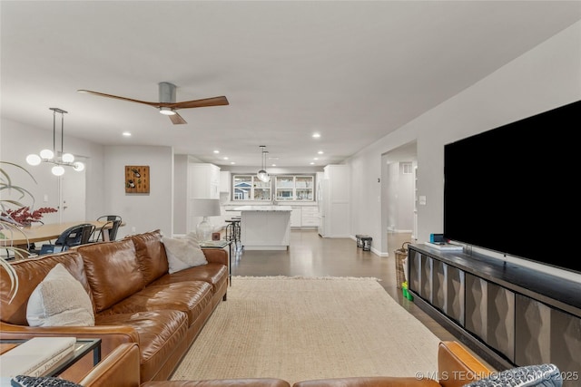 living room with hardwood / wood-style floors and ceiling fan