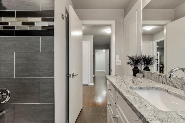 bathroom with vanity and wood-type flooring