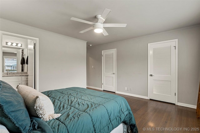 bedroom featuring ornamental molding, ceiling fan, dark hardwood / wood-style flooring, and ensuite bath