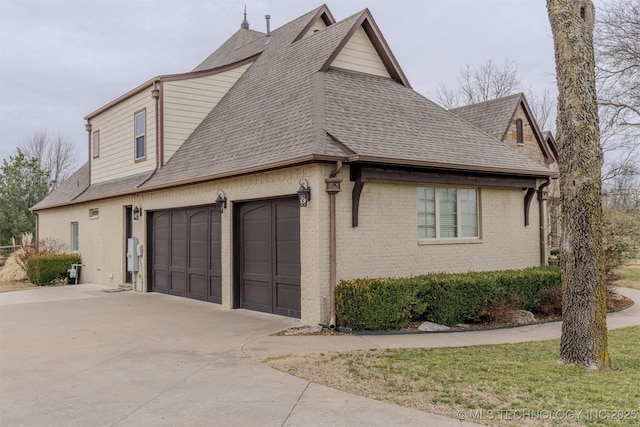 view of side of property with a garage