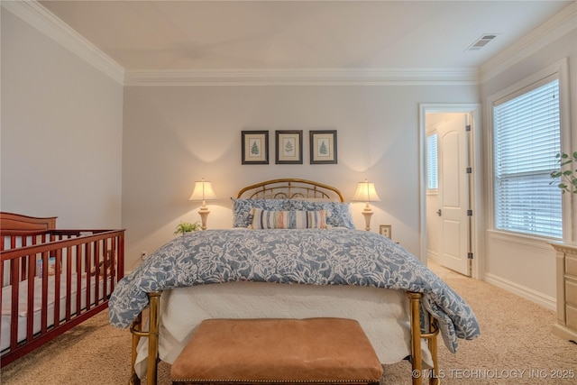 carpeted bedroom with ornamental molding