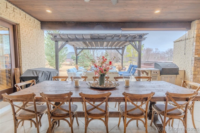 view of patio / terrace with area for grilling and a pergola