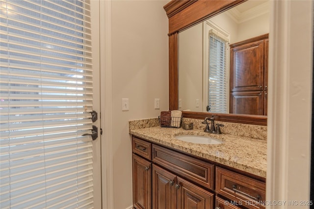 bathroom featuring vanity and crown molding