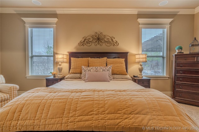 carpeted bedroom featuring crown molding and multiple windows