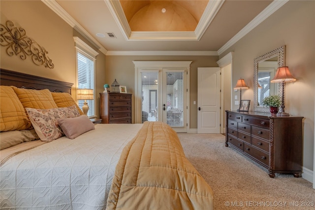 carpeted bedroom featuring access to exterior, crown molding, a raised ceiling, and french doors