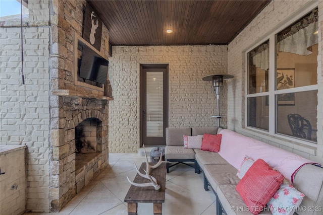 view of patio / terrace featuring an outdoor living space with a fireplace