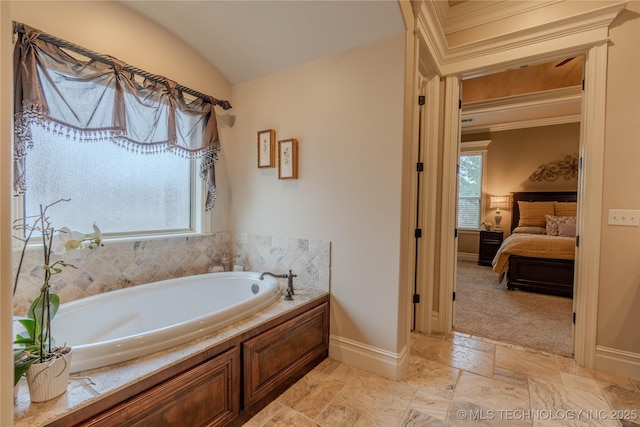 bathroom featuring crown molding, lofted ceiling, and a bath