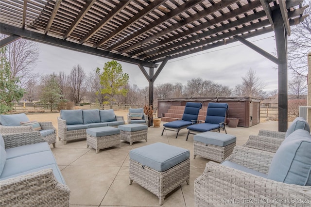 view of patio with a hot tub, outdoor lounge area, and a pergola