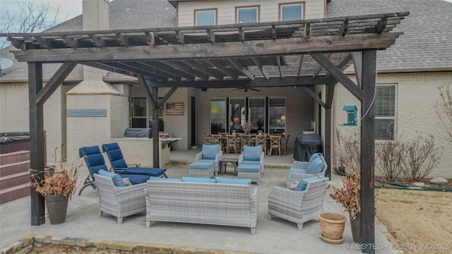 view of patio with a grill, an outdoor hangout area, and a pergola