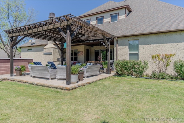 rear view of property featuring a pergola, a yard, outdoor lounge area, a patio, and brick siding