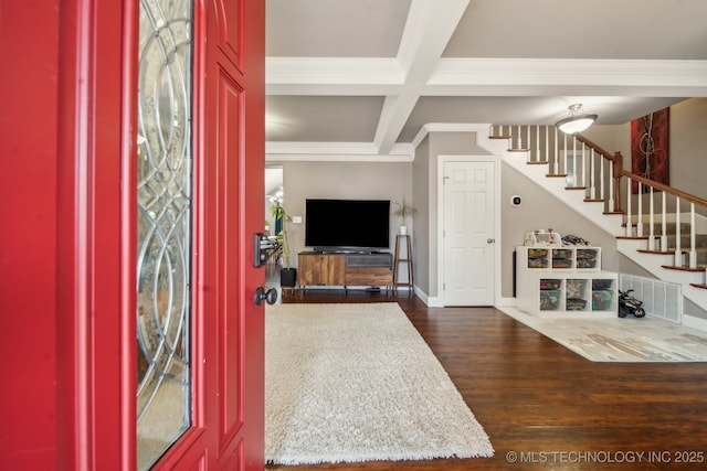 foyer entrance with coffered ceiling, crown molding, wood-type flooring, and beam ceiling