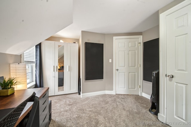 bedroom featuring light colored carpet