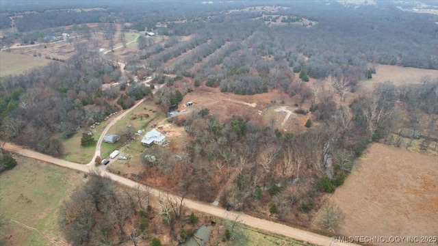 birds eye view of property with a rural view