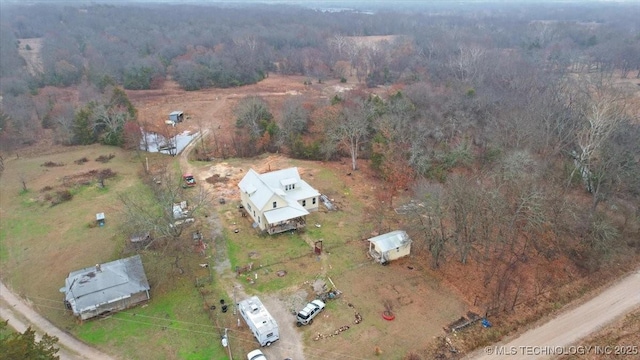 birds eye view of property with a rural view