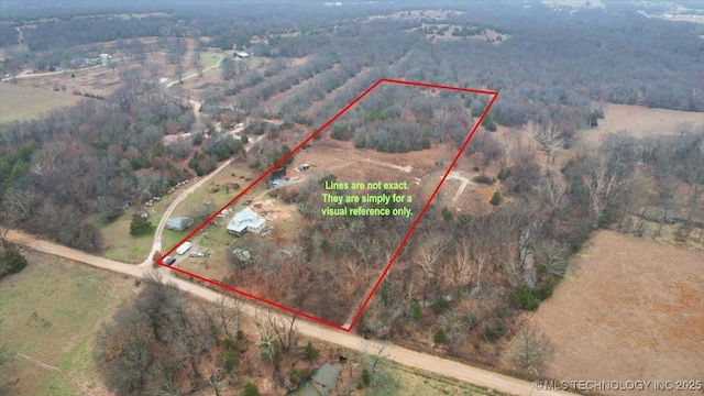 birds eye view of property with a rural view