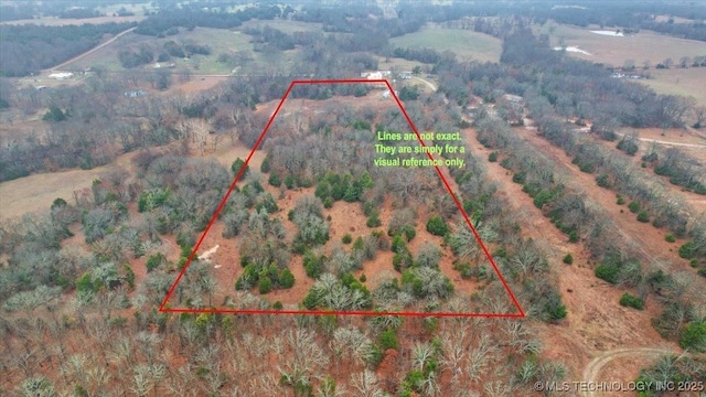 birds eye view of property with a rural view