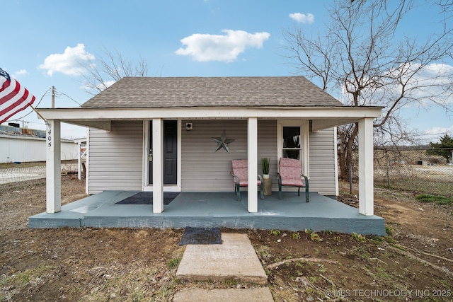 rear view of property with a porch