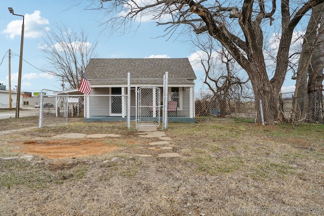 bungalow-style home with an outbuilding