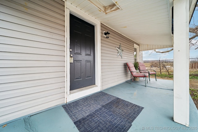 property entrance with covered porch