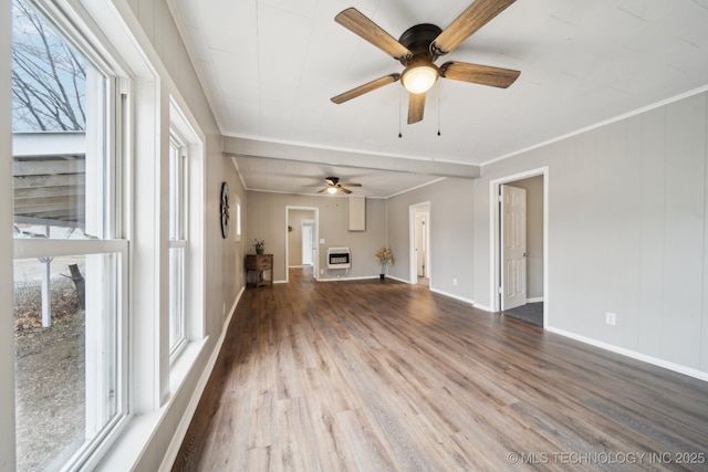 unfurnished living room featuring hardwood / wood-style flooring, ceiling fan, crown molding, and heating unit