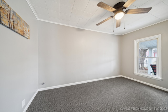 carpeted spare room featuring crown molding and ceiling fan