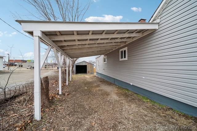 exterior space with a carport