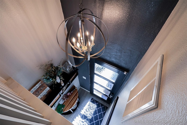 foyer entrance featuring a chandelier