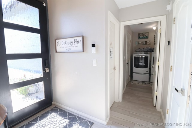 interior space with washer / clothes dryer and hardwood / wood-style floors