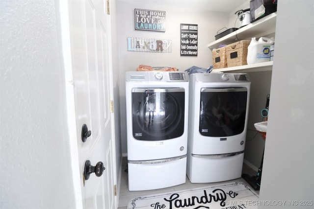 laundry area with washing machine and dryer