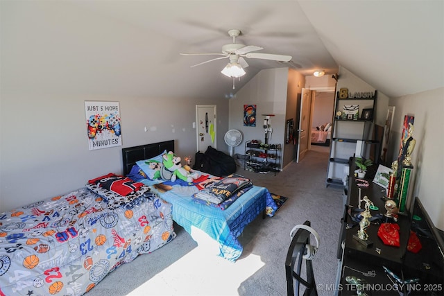 carpeted bedroom with ceiling fan and vaulted ceiling