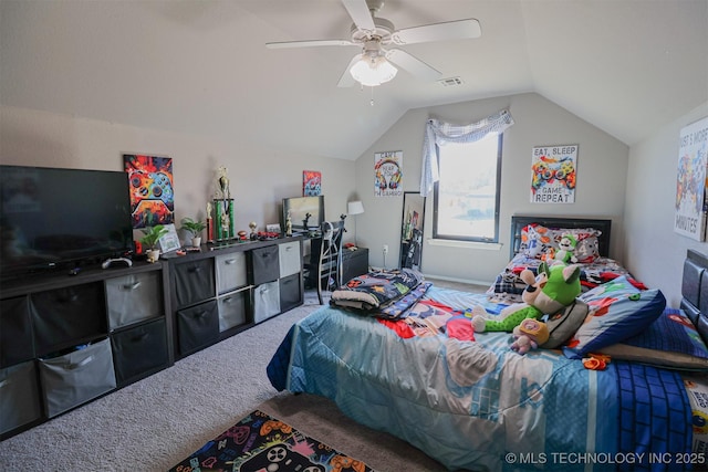 bedroom with ceiling fan, lofted ceiling, and carpet floors