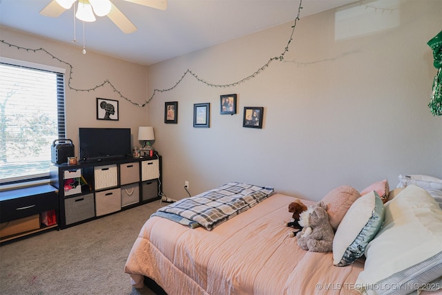 carpeted bedroom featuring ceiling fan