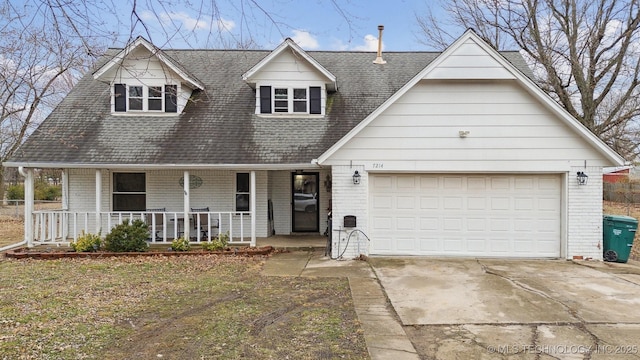 view of front of house featuring a garage and covered porch