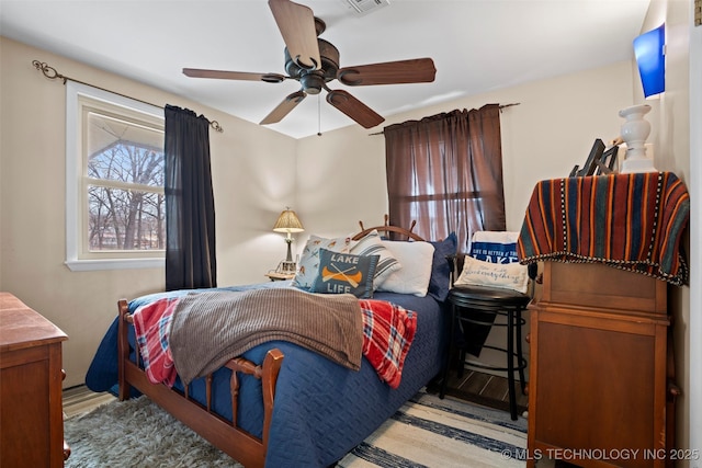 bedroom featuring ceiling fan and light hardwood / wood-style floors